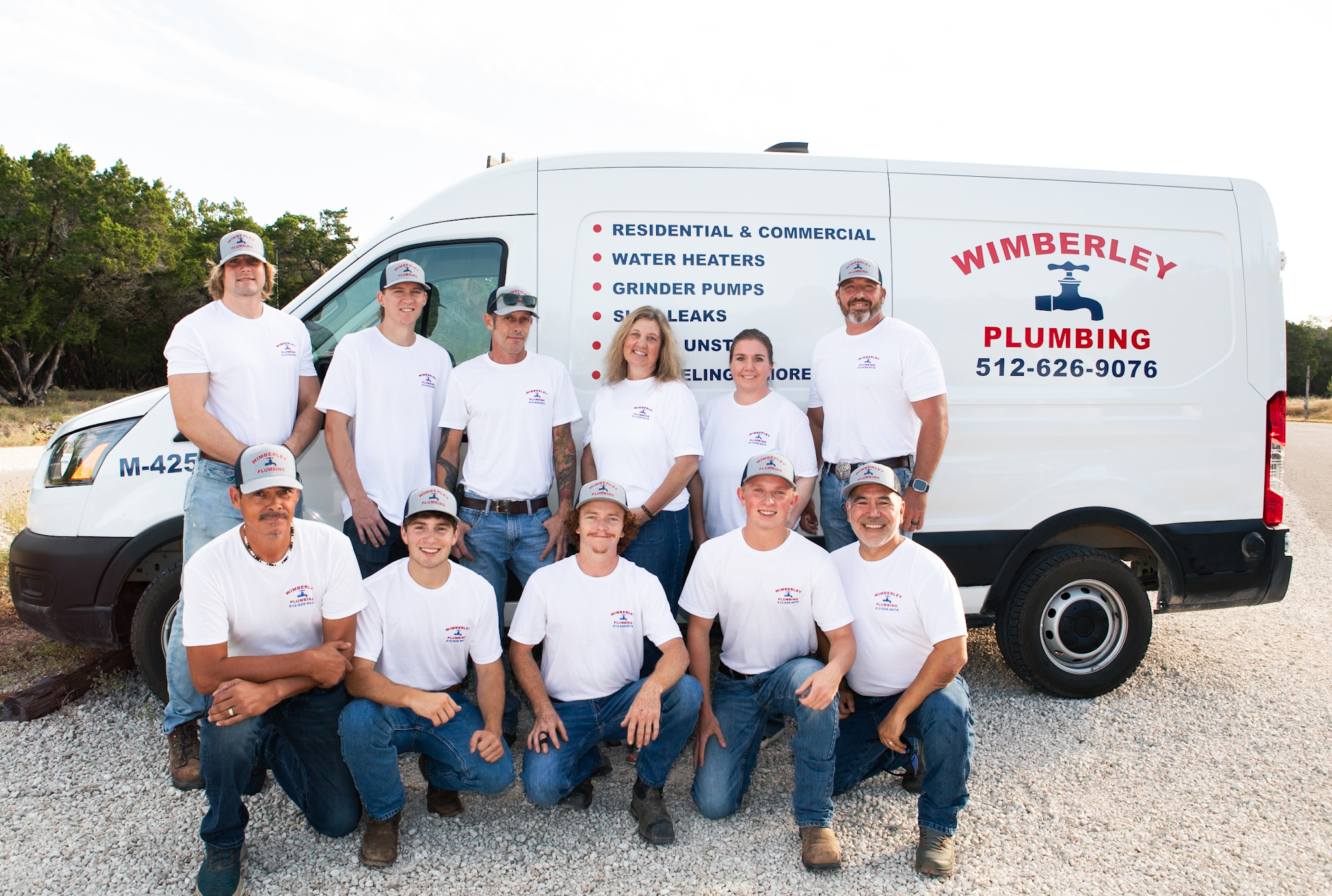 The Wimberley Plumbing Services team in front of a company van